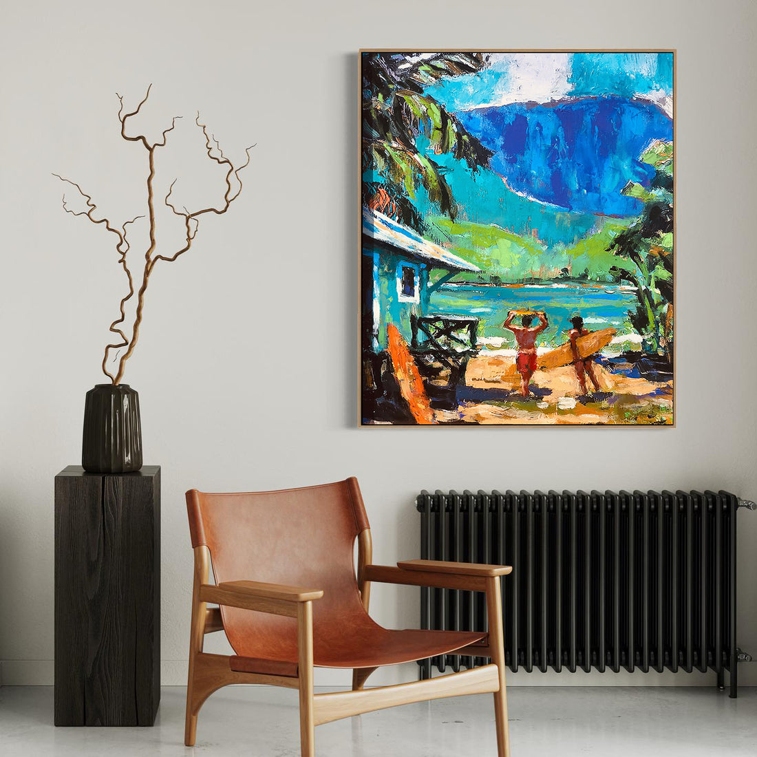 a painting hanging on a wall next to a chair