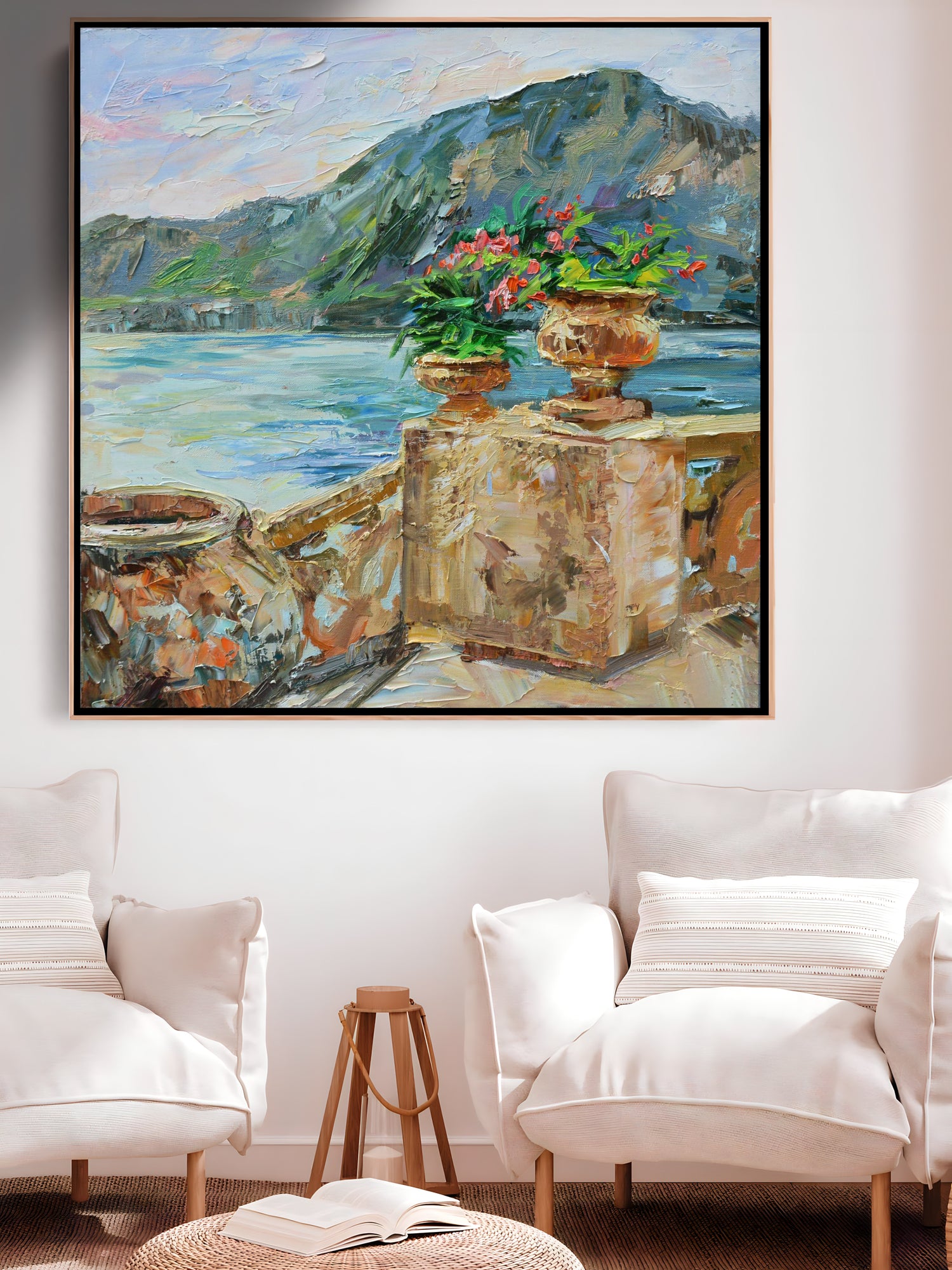 a living room with two white chairs and a painting on the wall