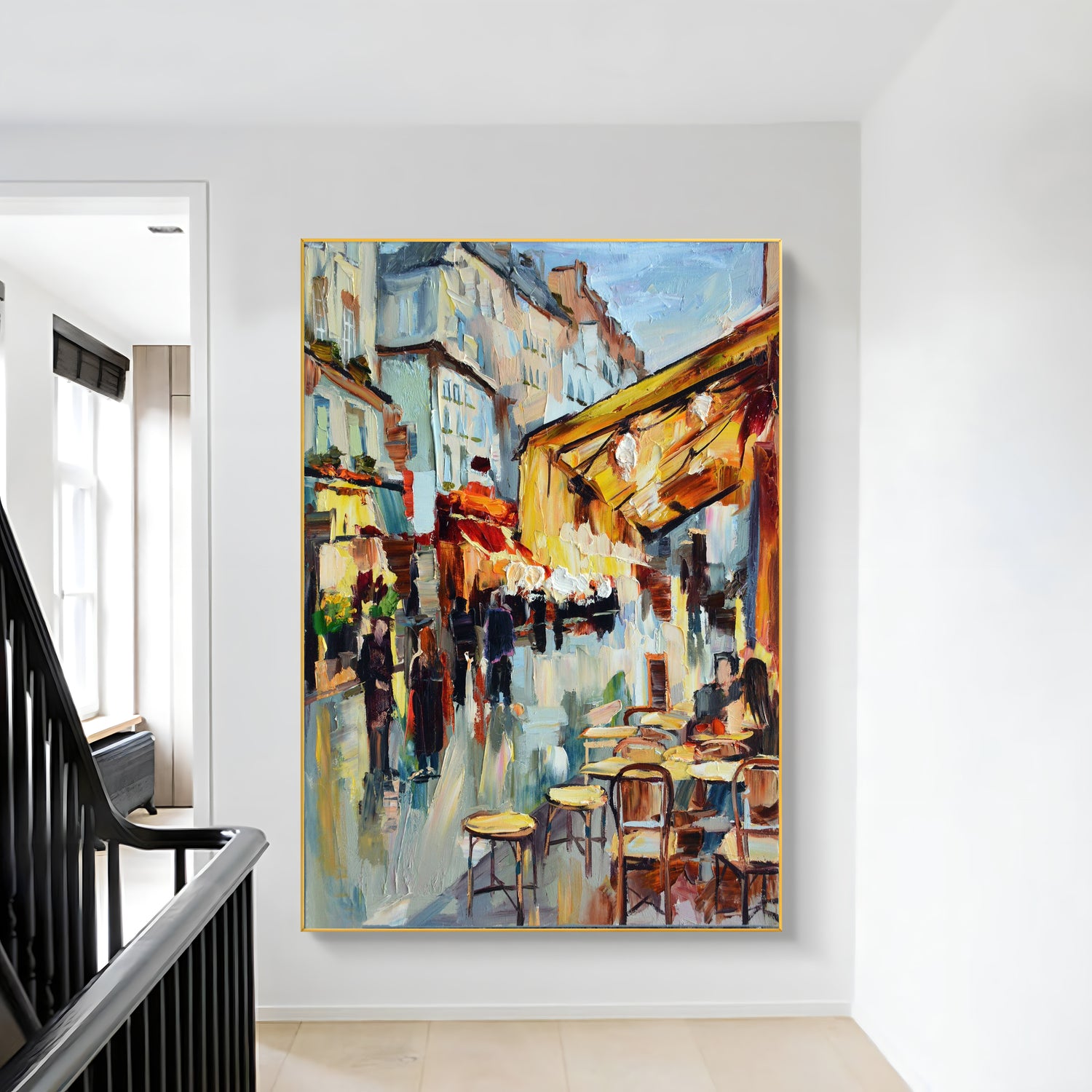 a painting hanging on a wall next to a banister