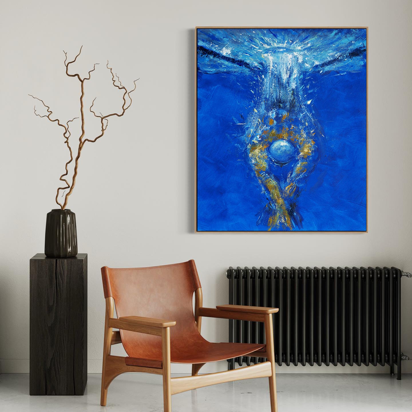 a painting on a wall above a chair in a room